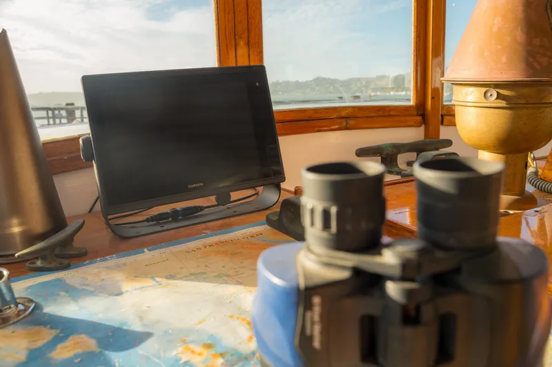 Slide: The Image of Vintage ship's helm with binoculars, map, and navigation equipment, Blanchard Shipyard Custom, 1922. - 29