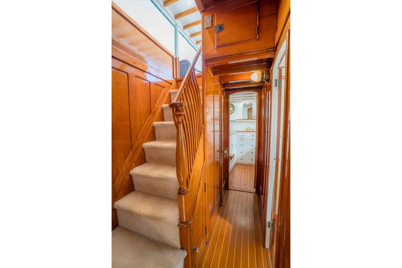 Slide: The Image of Wooden interior staircase and hallway on a 1922 Blanchard Shipyard custom boat. - 50