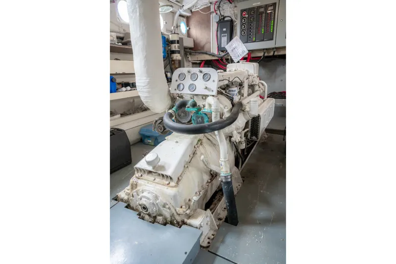 Slide: The Image of Engine room of 1922 Blanchard Shipyard Custom boat, featuring vintage machinery and control panels. - 73
