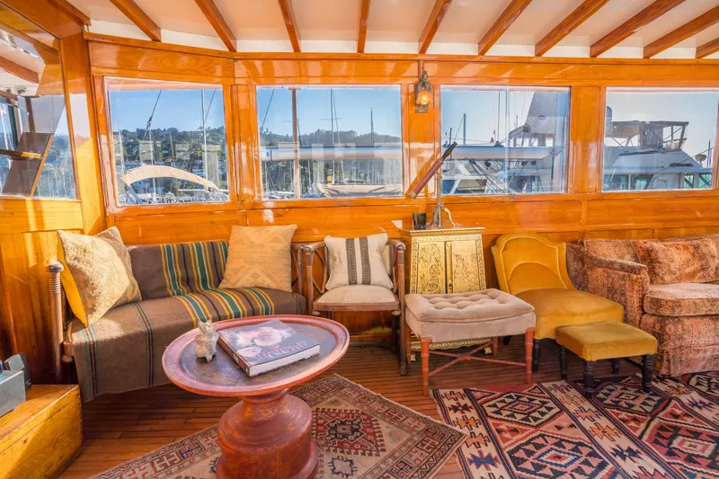 Slide: The Image of Luxurious 1922 Blanchard Shipyard custom yacht interior with vintage decor and panoramic windows. - 6