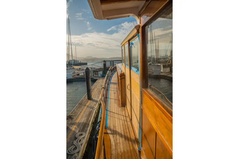Slide: The Image of Historic 1922 Blanchard Shipyard Custom boat docked at marina under clear sky. - 21