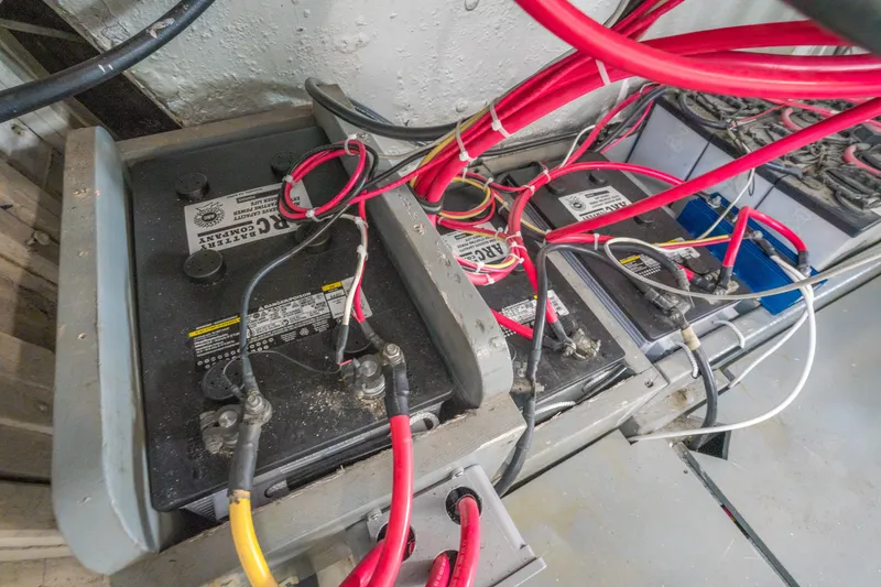 Slide: The Image of Battery compartment with red and black cables in a 1922 Blanchard Shipyard Custom model. - 87
