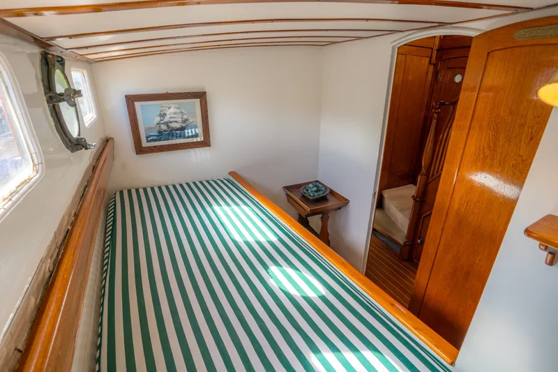 Slide: The Image of 1922 Blanchard Shipyard Custom cabin interior with striped bedding and nautical decor. - 62