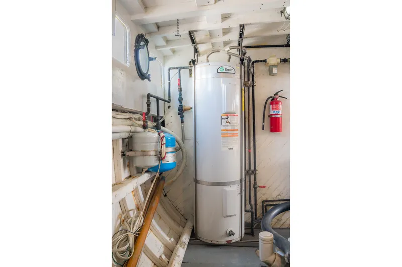 Slide: The Image of Water heater and fire extinguisher in 1922 Blanchard Shipyard custom boat interior. - 80