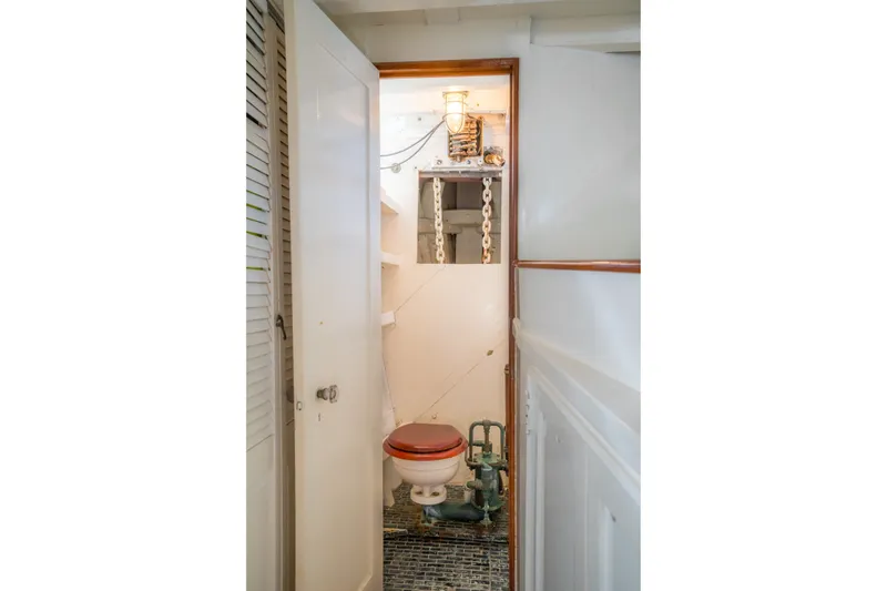 Slide: The Image of Vintage 1922 Blanchard Shipyard Custom boat bathroom with classic fixtures and wooden accents. - 71