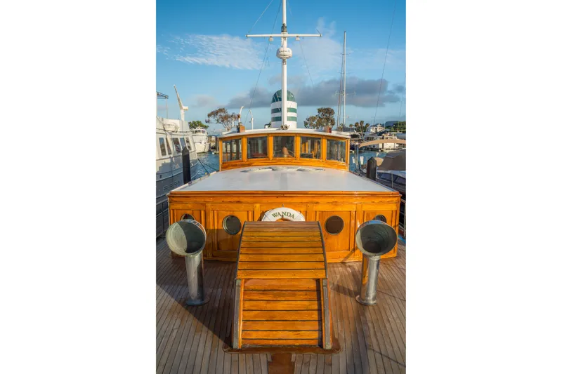 Slide: The Image of 1922 Blanchard Shipyard Custom boat with wooden deck and cabin, docked at marina. - 97