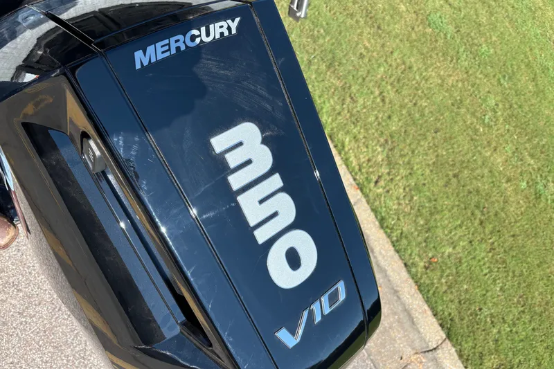 Slide: The Image of Mercury V10 engine on Regency R250DL3, 2027 model, parked on grass. - 11