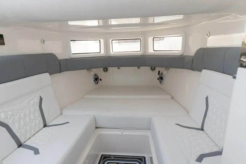 Slide: The Image of Manufacturer Provided Image: Interior of 2026 Deep Impact 449 Sport boat with white and gray seating. - 15