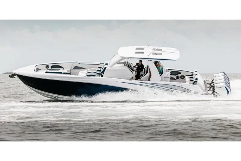 Slide: The Image of Manufacturer Provided Image: 2025 Deep Impact 399 Sport boat cruising on open water. - 7