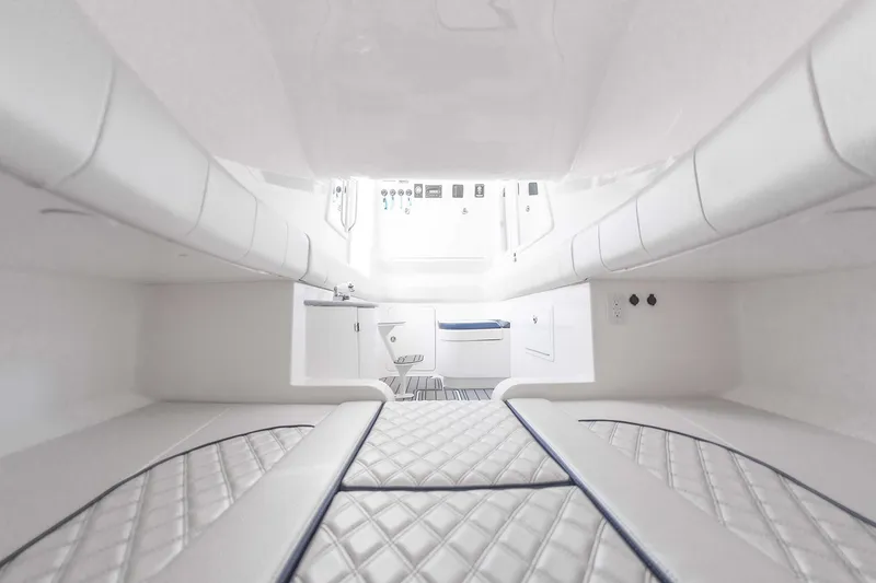 Slide: The Image of Manufacturer Provided Image: Luxurious interior of 2025 Deep Impact 399 Sport boat with quilted seating. - 14