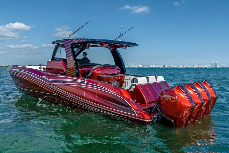 Slide: The Image of Manufacturer Provided Image: 2026 Deep Impact 399 Sport boat with quad engines on open water. - 1