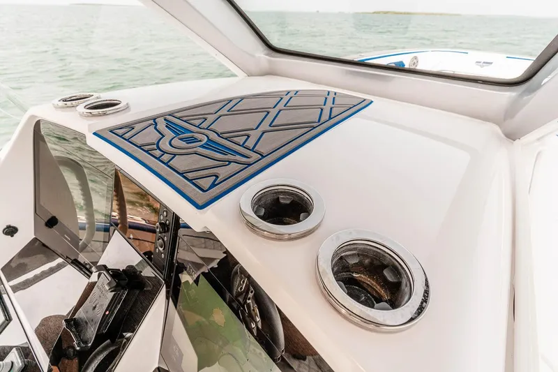 Slide: The Image of Manufacturer Provided Image: 2025 Deep Impact 399 Sport boat dashboard with modern design and ocean view. - 12