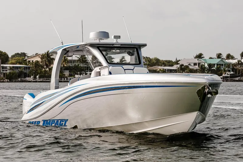 Slide: The Image of Manufacturer Provided Image: 2025 Deep Impact 399 Sport boat cruising on water, showcasing sleek design and modern features. - 5
