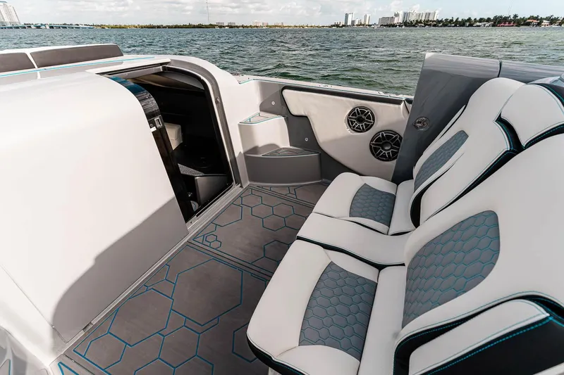 Slide: The Image of Manufacturer Provided Image: Luxurious interior of 2025 Deep Impact 399 Cabin boat with stylish seating and ocean view. - 10