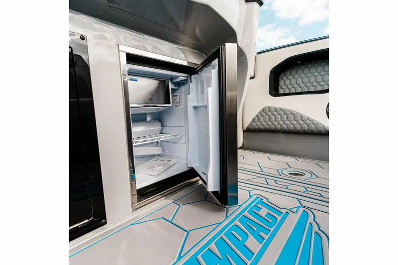 Slide: The Image of Manufacturer Provided Image: Open fridge on 2025 Deep Impact 399 Cabin boat with stylish interior design. - 9