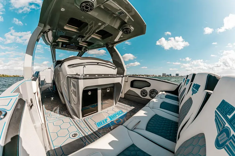 Slide: The Image of Manufacturer Provided Image: Luxurious 2025 Deep Impact 399 Cabin boat interior with modern seating and sleek design. - 5