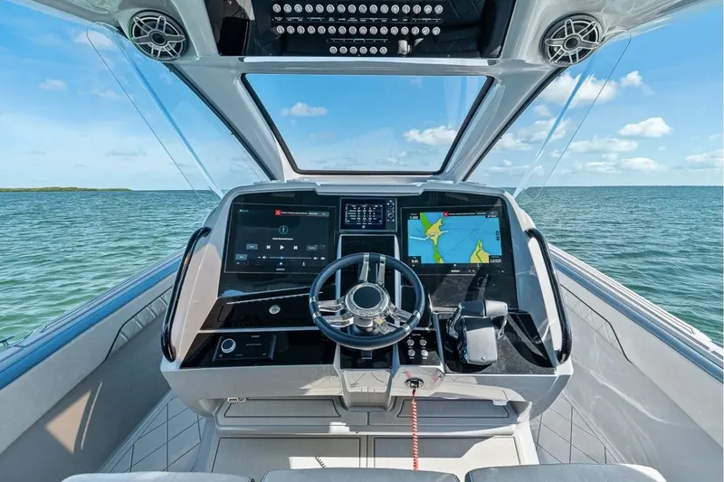 Slide: The Image of Manufacturer Provided Image: Modern helm of 2026 Deep Impact 369 Sport boat with navigation screens. - 7