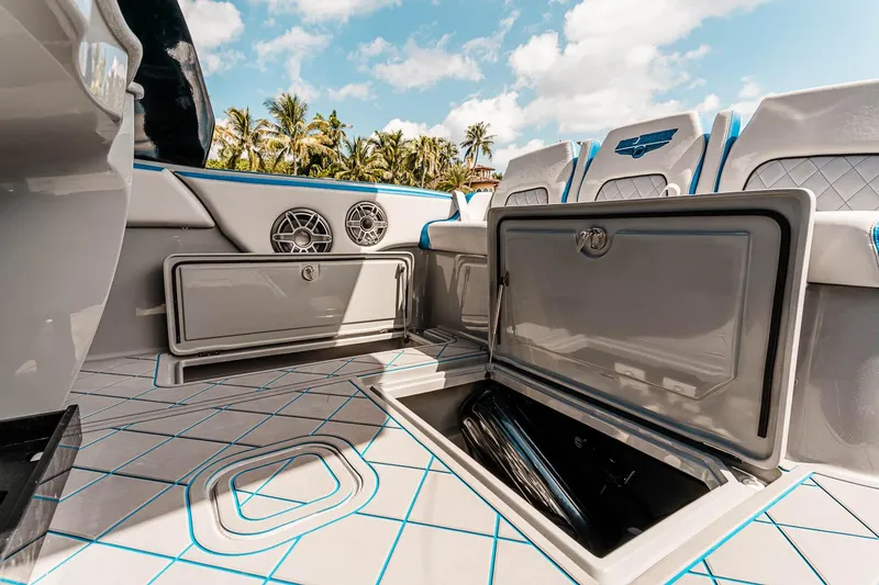 Slide: The Image of Manufacturer Provided Image: 2025 Deep Impact 369 Sport boat interior with open storage compartments and modern design. - 9
