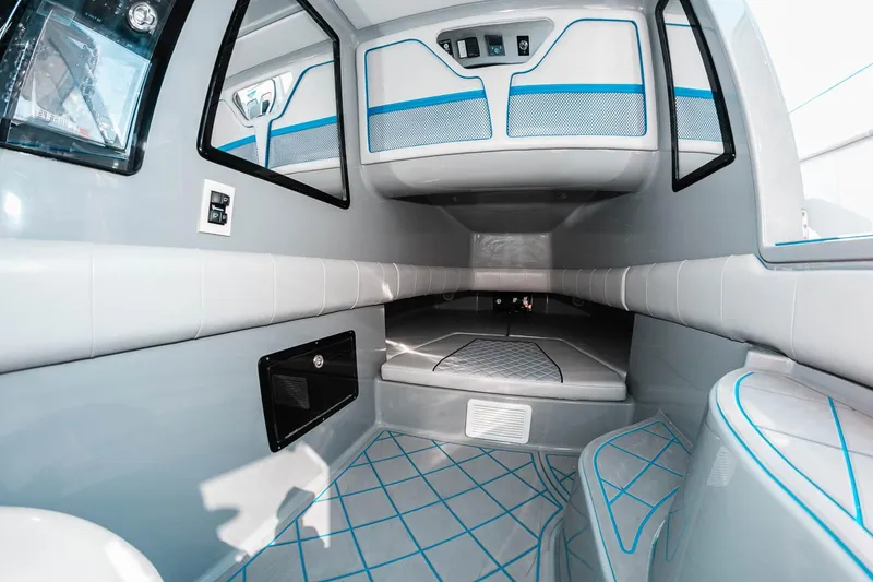 Slide: The Image of Manufacturer Provided Image: Interior of 2025 Deep Impact 369 Sport boat, featuring modern design and blue accents. - 10