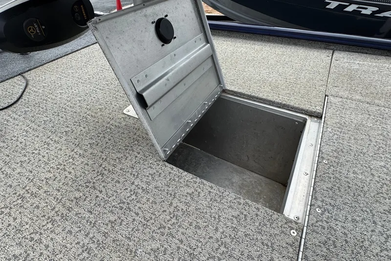 Slide: The Image of Open storage compartment on 2021 Tracker Pro Team 170 TX boat deck. - 18
