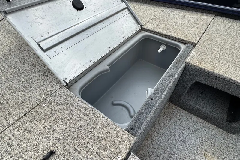 Slide: The Image of Open storage compartment on 2021 Tracker Pro Team 170 TX boat deck. - 16