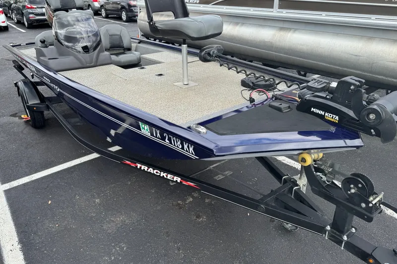 The Image of 2021 Tracker Pro Team 170 TX fishing boat with Minn Kota trolling motor on trailer. - 0