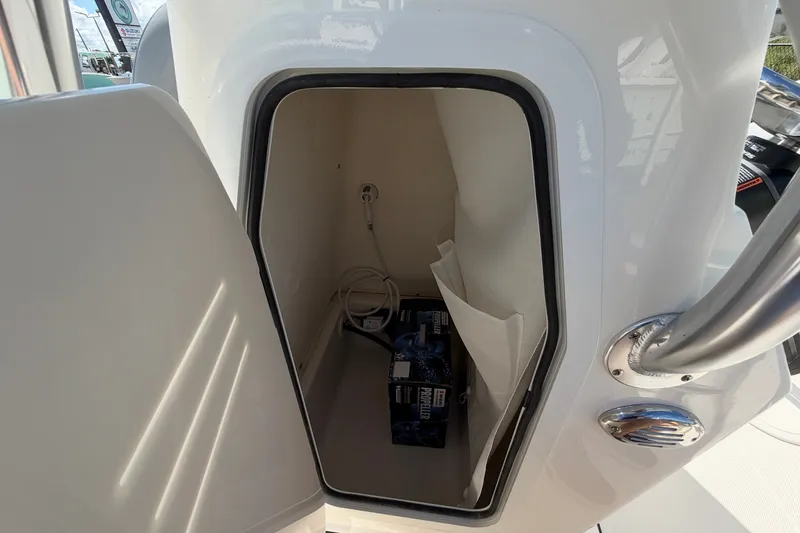Slide: The Image of Storage compartment of 2027 Pioneer 220 Bay Sport boat with cables and equipment. - 15