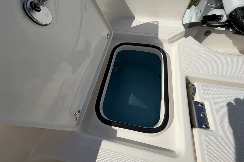 Slide: The Image of Livewell compartment on a 2027 Pioneer 220 Bay Sport boat, open lid view. - 20