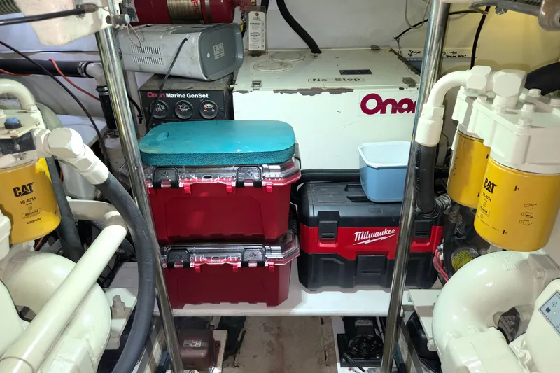 Slide: The Image of Engine room of 2001 Grand Banks 43 Eastbay HX with tools and generator. - 27