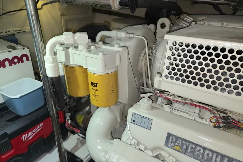 Slide: The Image of Engine room of 2001 Grand Banks 43 Eastbay HX with Caterpillar components and tools. - 30