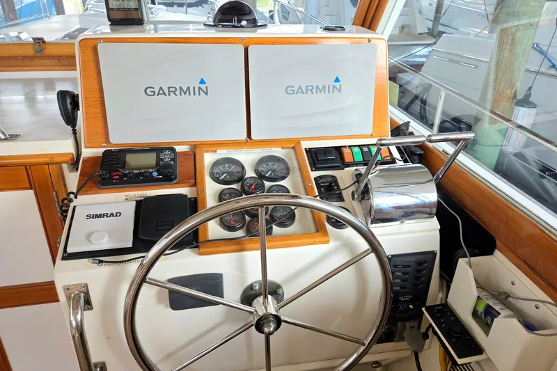 Slide: The Image of Helm of 2001 Grand Banks 43 Eastbay HX with Garmin and Simrad navigation systems. - 11