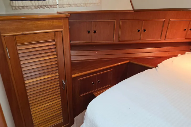 Slide: The Image of Luxurious wooden interior of 2001 Grand Banks 43 Eastbay HX yacht cabin. - 21