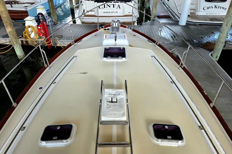 Slide: The Image of 2001 Grand Banks 43 Eastbay HX yacht deck with hatches and railing in marina. - 5