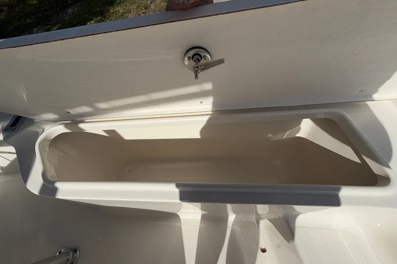 Slide: The Image of Open storage compartment on a 2027 Bulls Bay 2200 XS boat, showcasing interior space. - 12