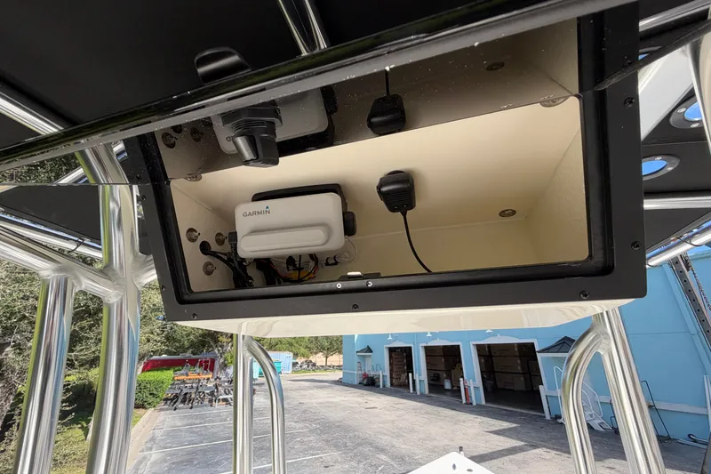 Slide: The Image of 2027 Bulls Bay 2200 XS boat console with Garmin electronics and microphone setup. - 8