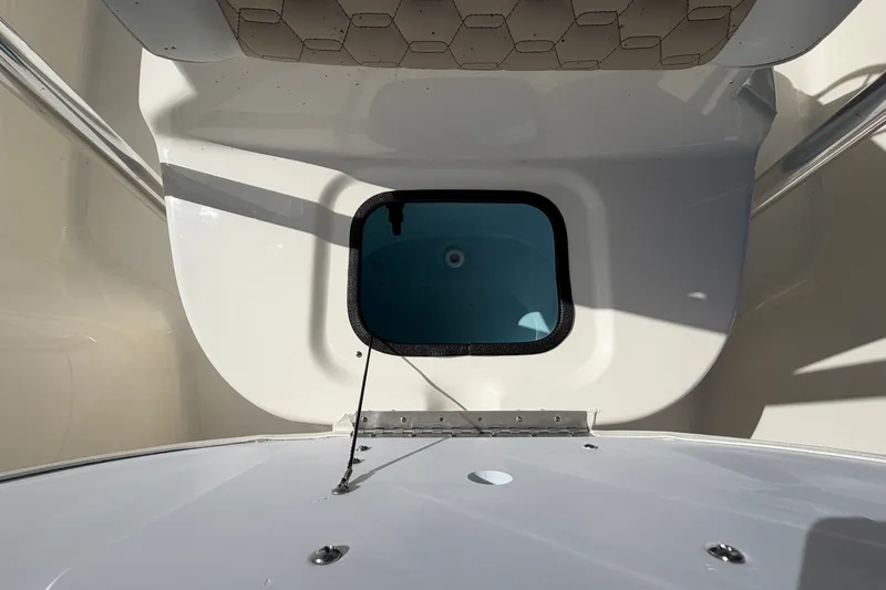Slide: The Image of Interior view of 2027 Bulls Bay 2200 XS boat, featuring a storage compartment. - 14
