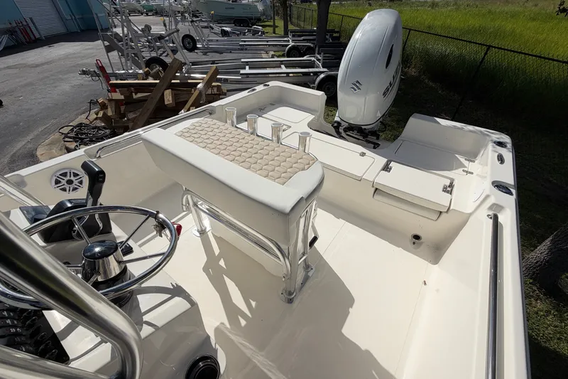 Slide: The Image of 2027 Bulls Bay 2200 XS boat interior with steering wheel and Suzuki outboard motor. - 15