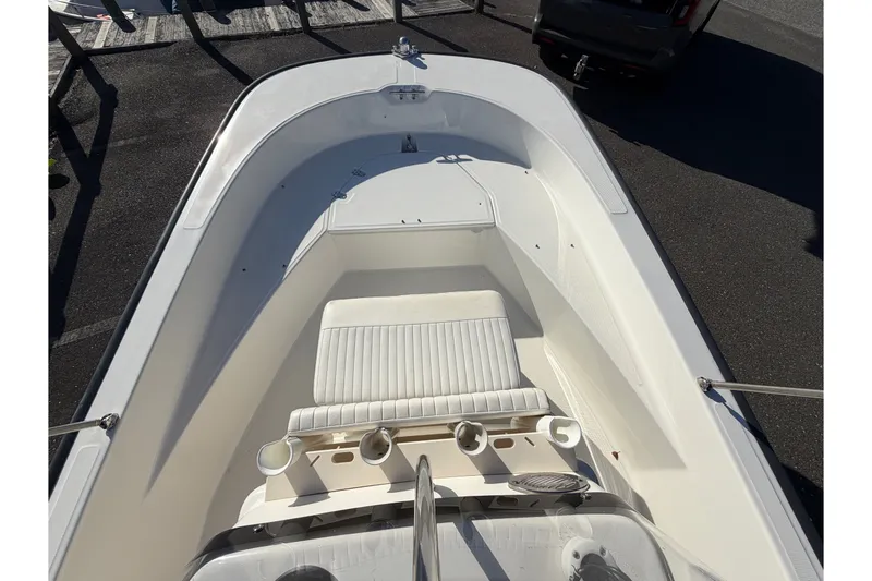 Slide: The Image of 2017 Boston Whaler 170 Montauk boat interior with seating and rod holders. - 16