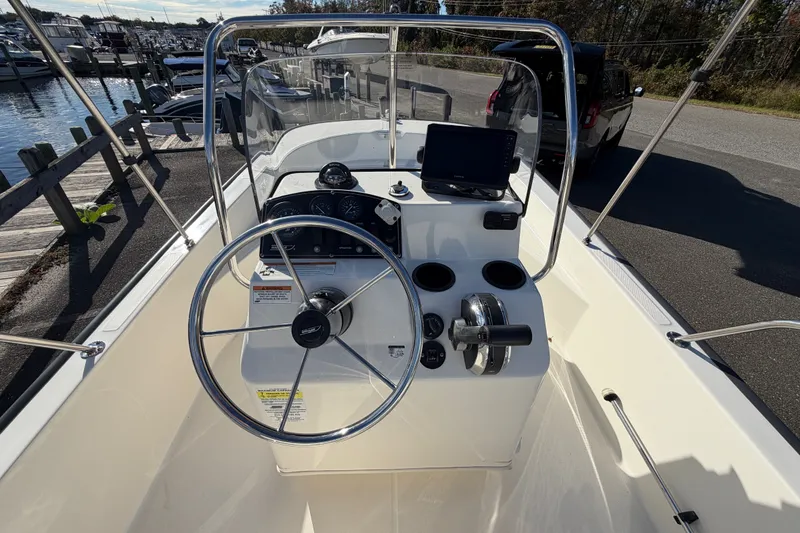 Slide: The Image of 2017 Boston Whaler 170 Montauk boat console with steering wheel and navigation equipment. - 14