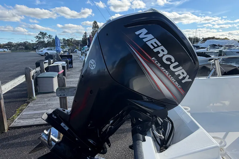 Slide: The Image of 2017 Boston Whaler 170 Montauk with Mercury FourStroke engine at marina. - 20