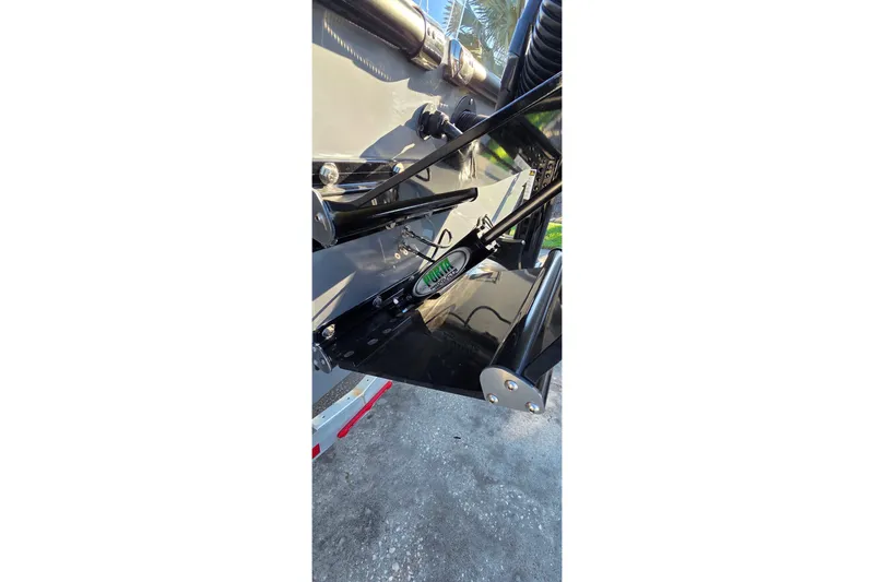 Slide: The Image of Close-up of 2024 Young Boats 26 Gulfshore hydraulic system and trim tab. - 18