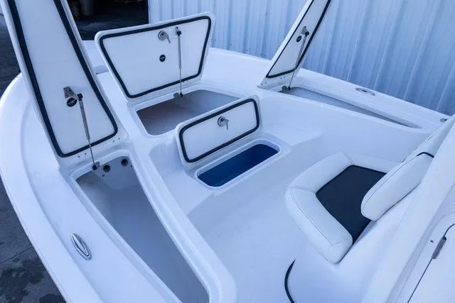 Slide: The Image of The image shows the deck of a Tidewater 2110 Bay Max boat with multiple storage compartments. - 2