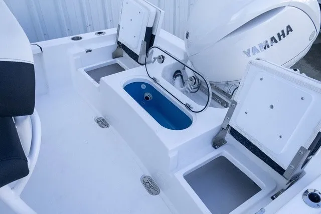 Slide: The Image of The image shows the stern of a Tidewater 2110 Bay Max boat with a Yamaha outboard motor. - 11