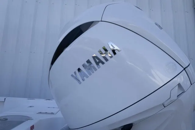 Slide: The Image of Close-up of a Yamaha outboard motor on a boat, set against a white background. - 14