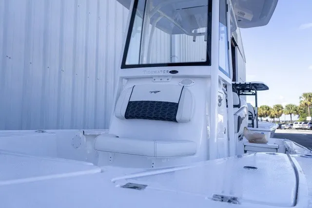 Slide: The Image of The image shows a modern boat with a sleek white design and a cushioned seat. - 3