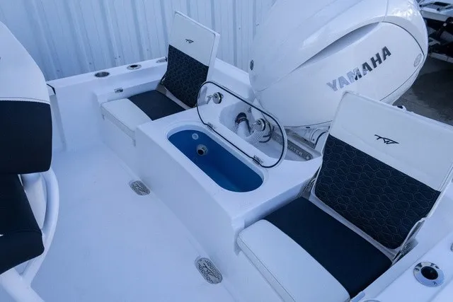 Slide: The Image of The image shows the stern of a Tidewater 2110 Bay Max boat with a Yamaha outboard motor. - 12