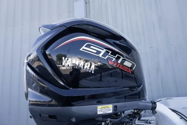 Slide: The Image of A Yamaha SHO Vmax outboard motor is mounted on a boat. - 13