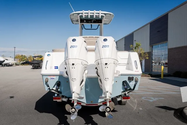 Slide: The Image of The image shows a 2027 Sea Hunt Ultra 265SE boat with twin outboard engines. - 5