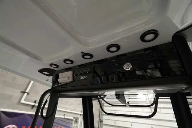 Slide: The Image of The image shows the roof of a Sea Hunt Ultra 285SE boat with built-in lights and speakers. - 13