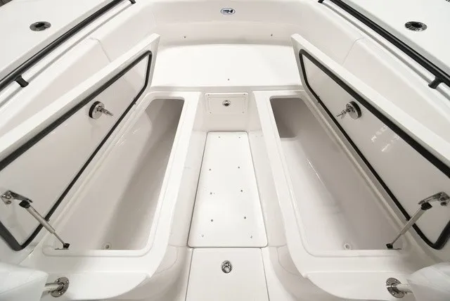 Slide: The Image of The image shows the bow storage area of a 2027 Sea Hunt Ultra 285SE boat. - 16